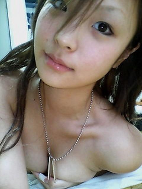 16P Asian coed goes full nude in couch shows squeezable tits