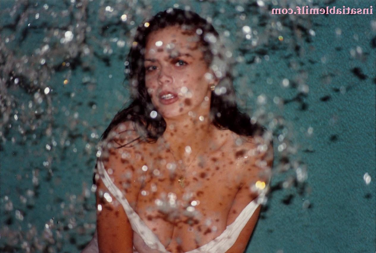 15P Sexy Diane Andrews posing in a fountain getting wet