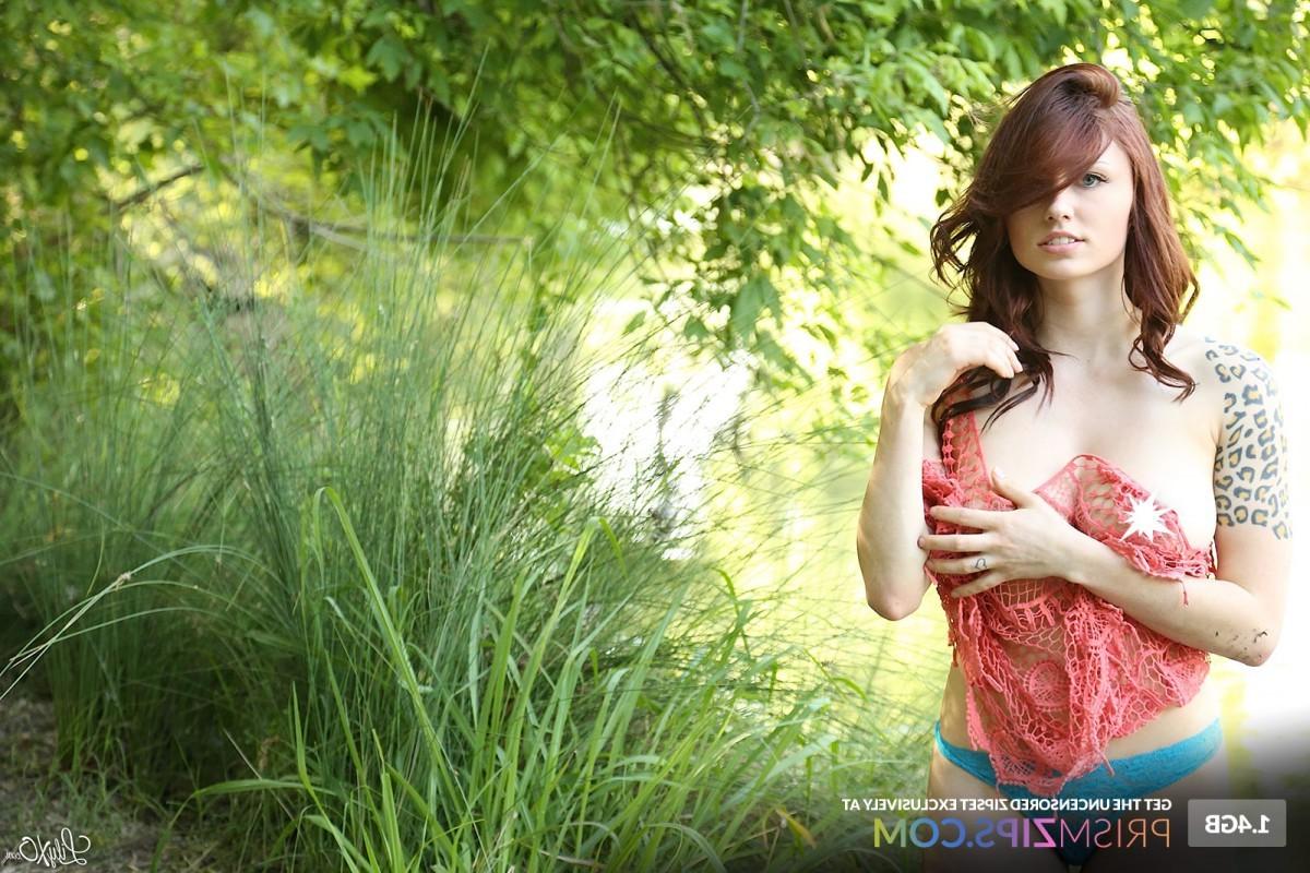 12P Busty brunette posing in a river