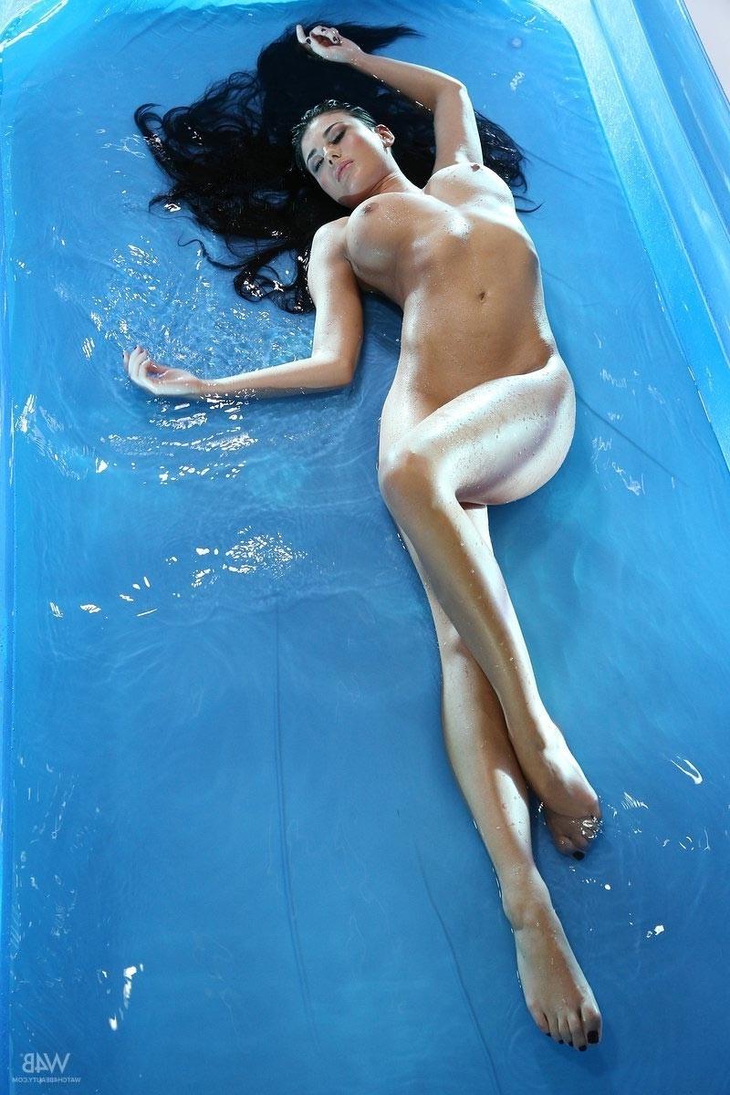 11P Busty wet brunette in a pool