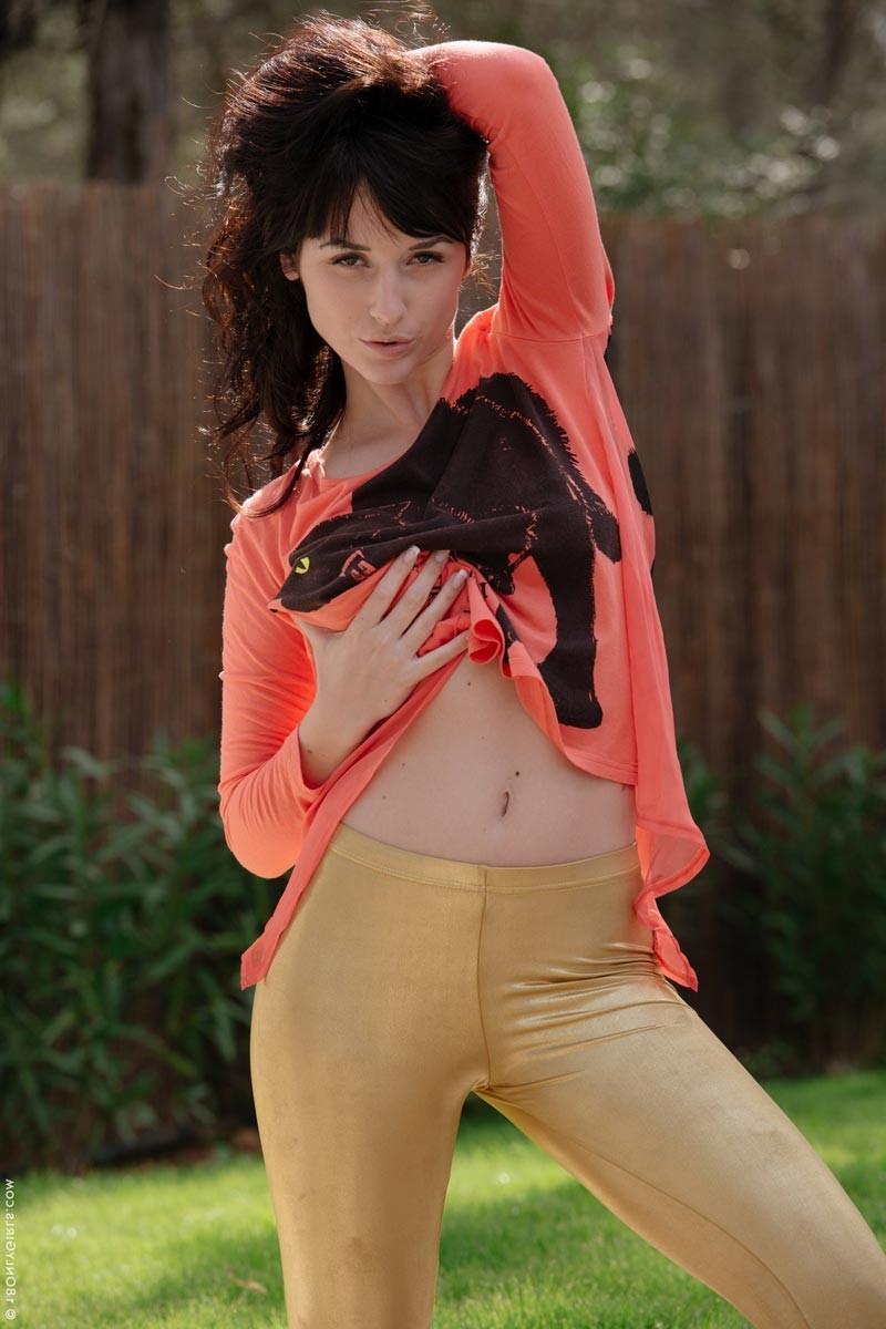 15P Busty brunette strips in the backyard
