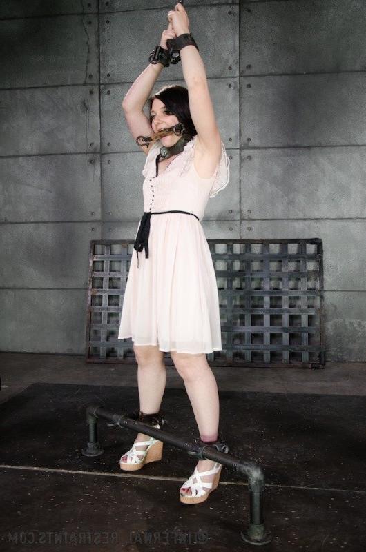 16P Amy Faye is bound in metal wearing high heels her pussy toyed to orgasm