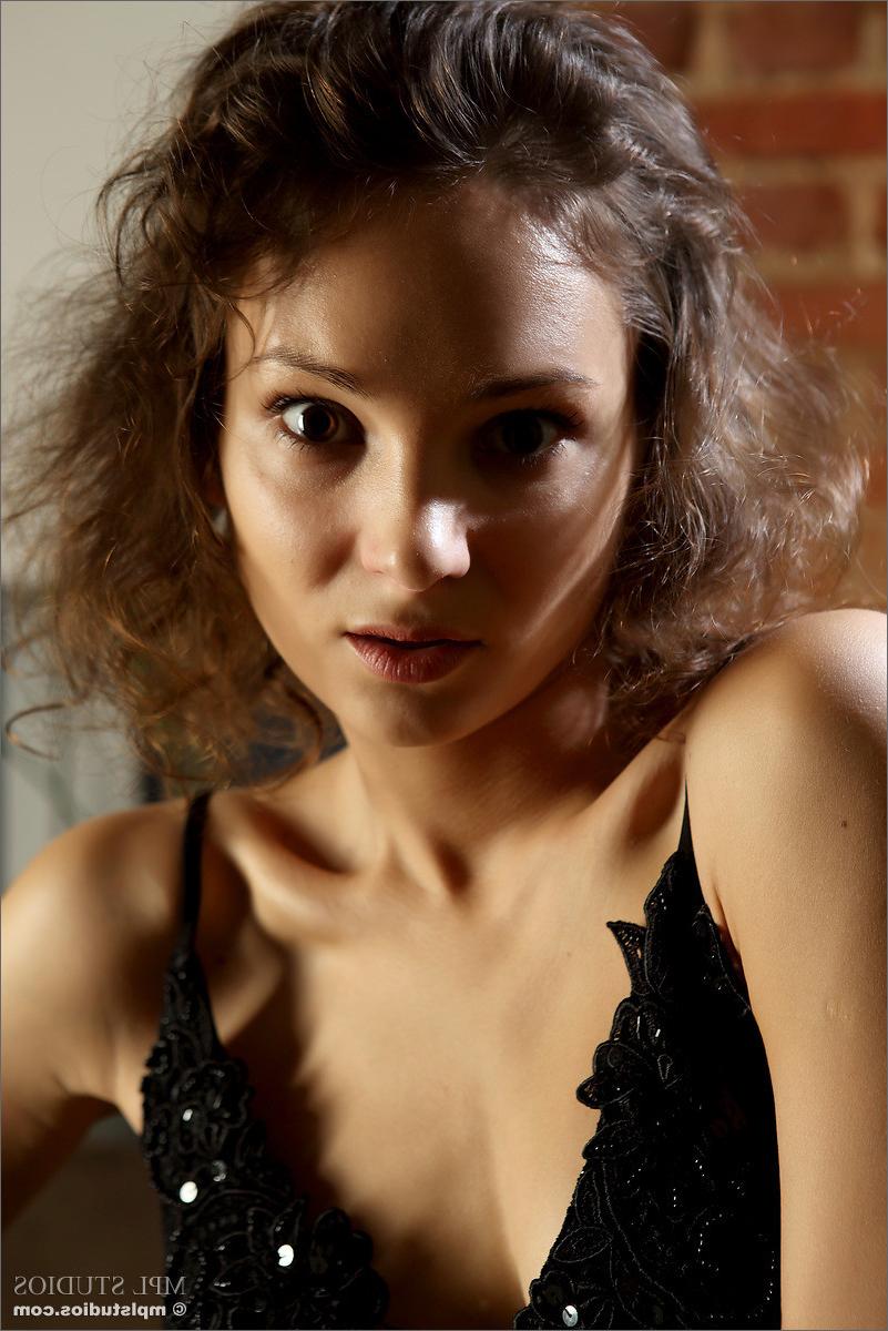12P Beautiful brunette teen Raina stripping off her dress