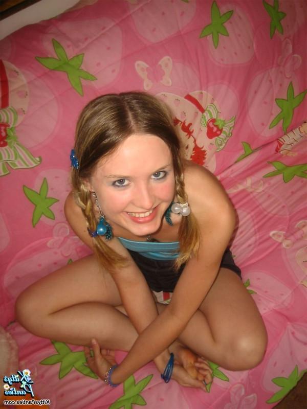 15P Beautiful young teen Kitty strips off Supergirl panties