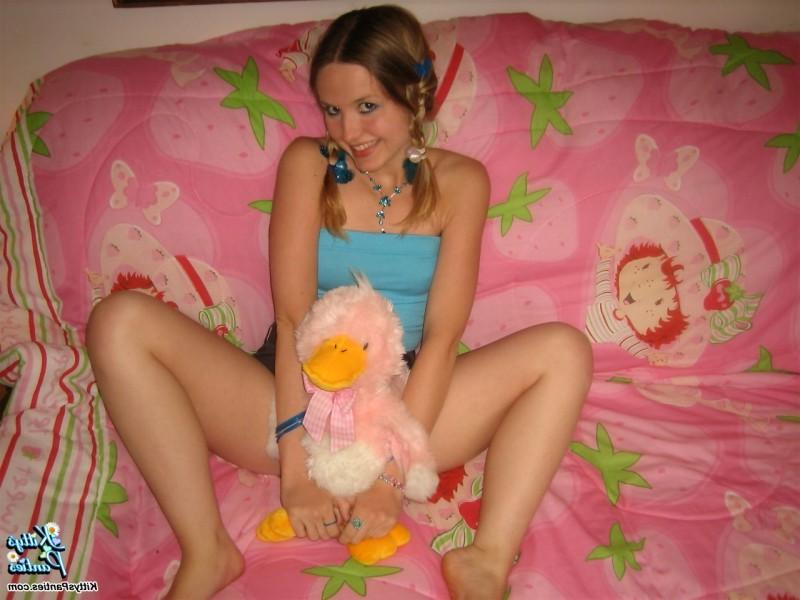 15P Beautiful young teen Kitty strips off Supergirl panties