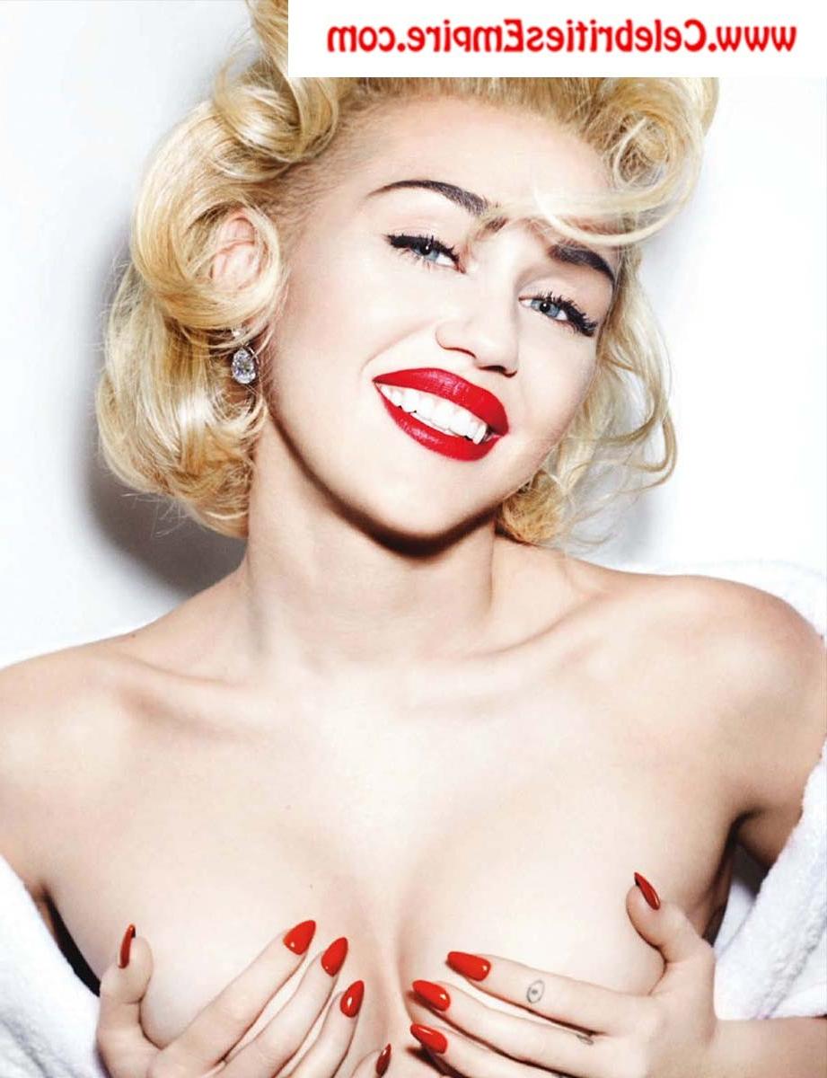 20P Miley Cyrus  spreads her legs and show nude tits