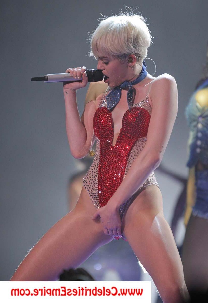 20P Miley Cyrus  spreads her legs and show nude tits