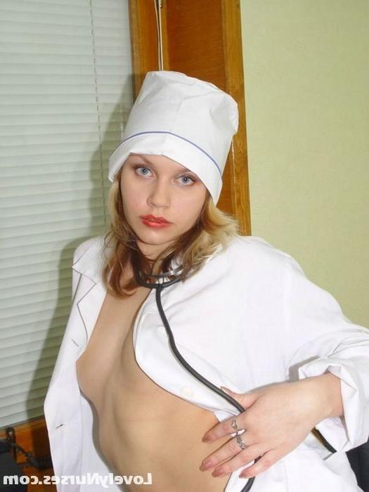 15P Sublime blonde nurse Christine teases us with her perky tits