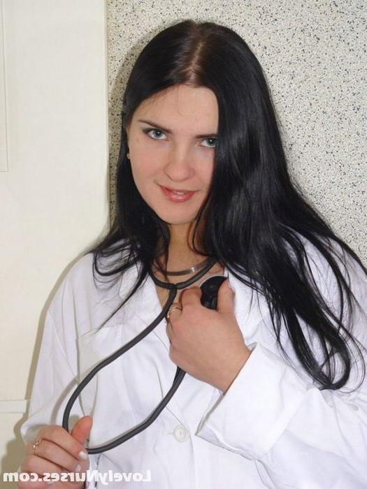15P Sexy brunette nurse Alice teases us with her black stockings