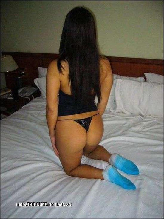15P Shy Asian chick posing with her ass in a tiny thong
