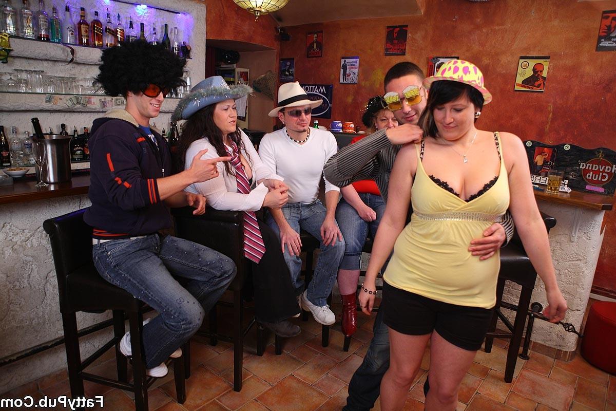 12P The pretty fat girl is fun and happy and a bit drunk as she bends over to take d