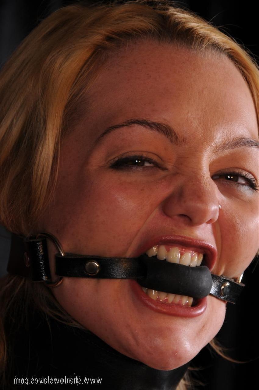 15P This cute blonde is bound in leather and rop and then gagged