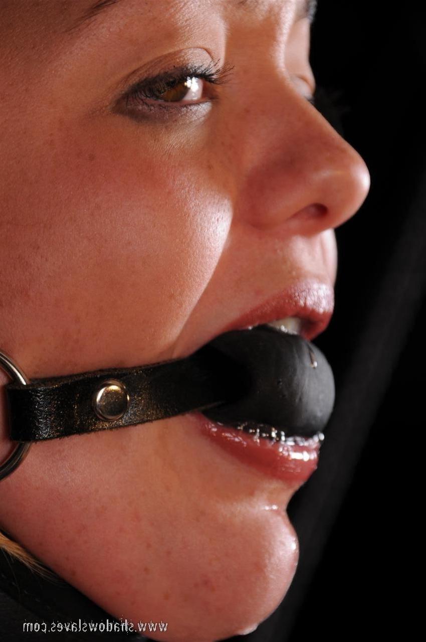 15P This cute blonde is bound in leather and rop and then gagged