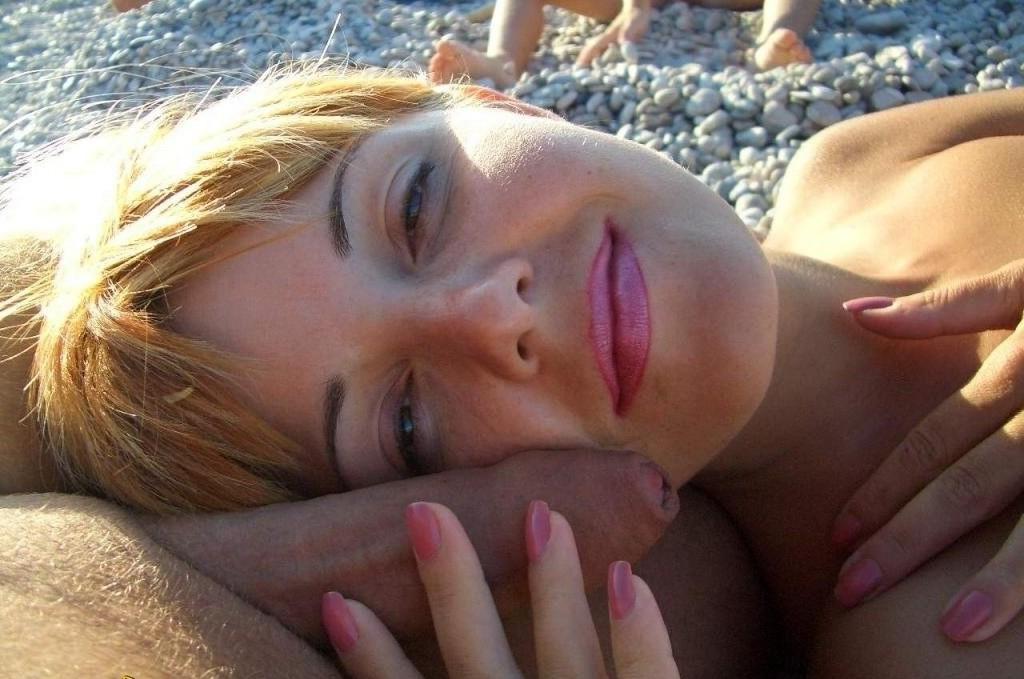 15P Check out this sexy nudist showing off her shaved pussy