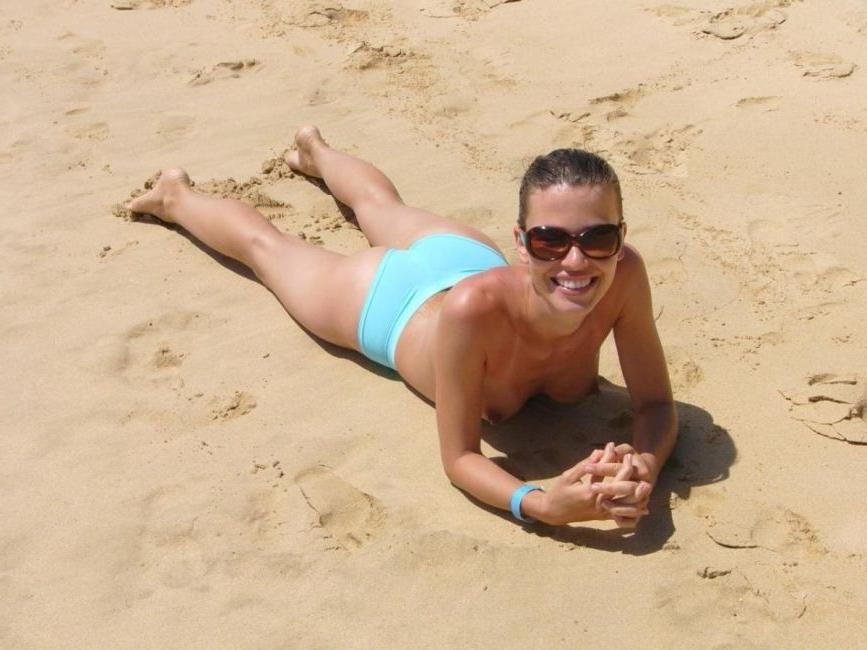 15P Check out this nudist showing off her pink pussy
