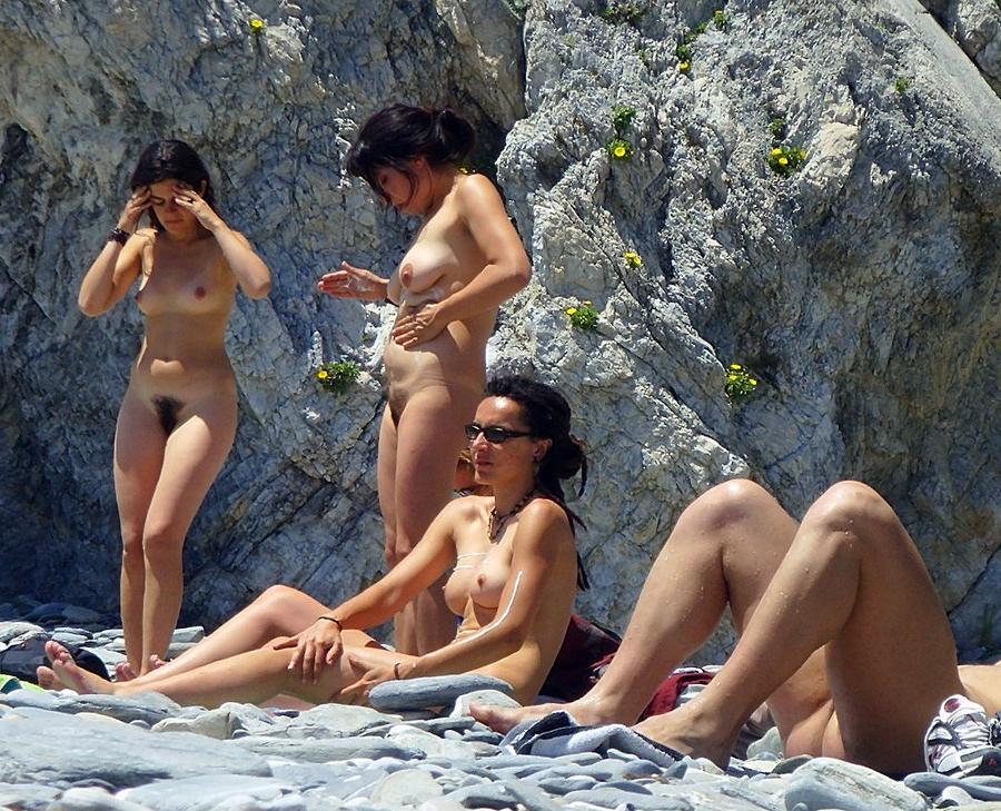 15P Check out this nudist showing off her shaved pussy