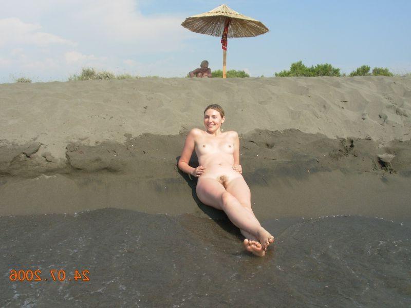 15P Check out this nudist showing off her shaved pussy
