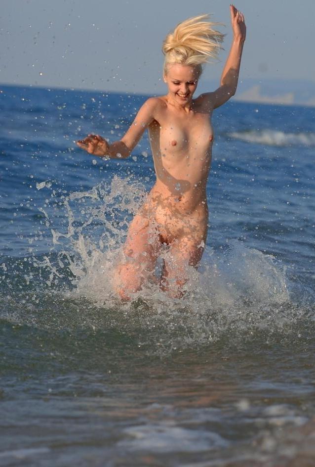 15P The water feels good on these nudist's bare skin