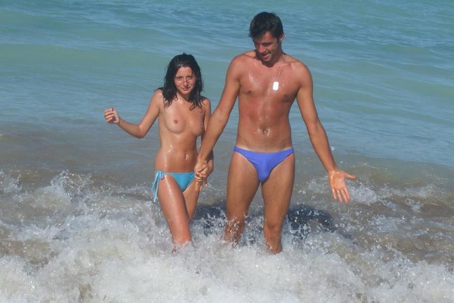 15P Check out this nudist showing off her shaved pussy