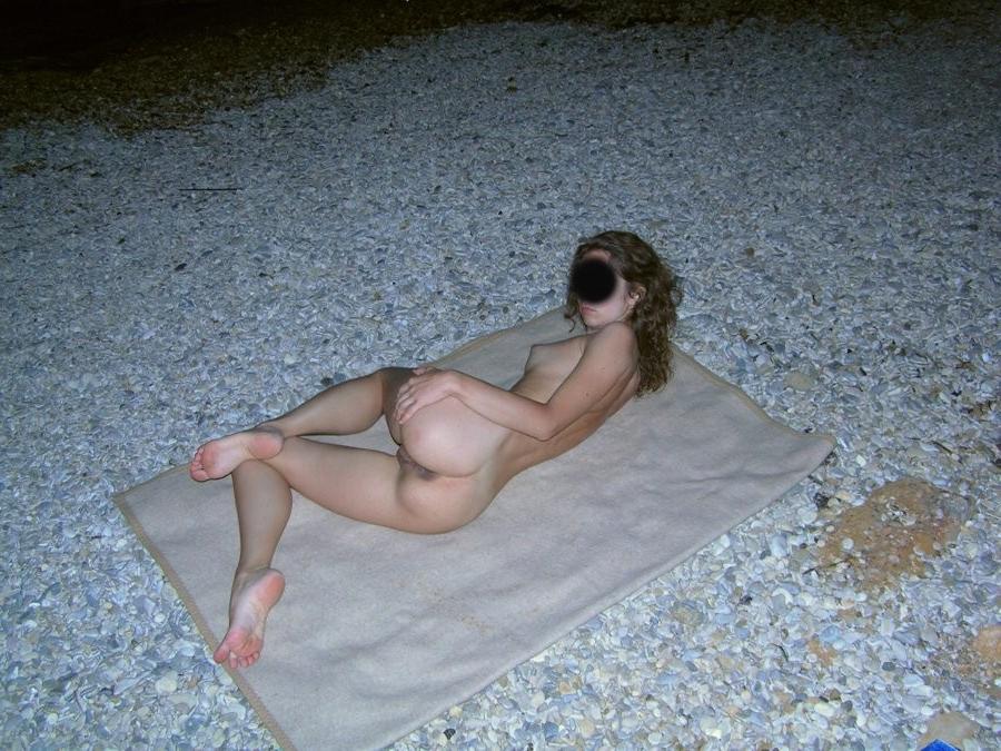 15P Check out this nudist showing off her shaved pussy