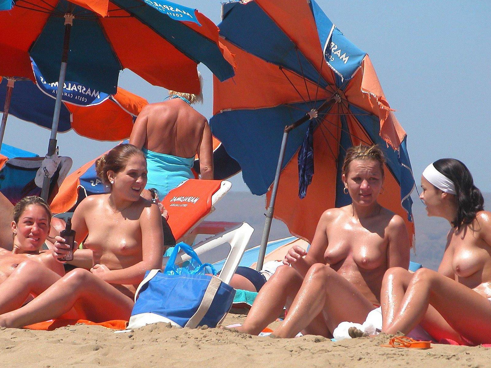 15P Check out this nudist showing off her shaved pussy