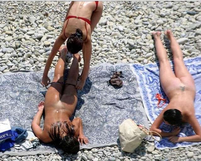 15P Watch the tits in the water from this nudist teen