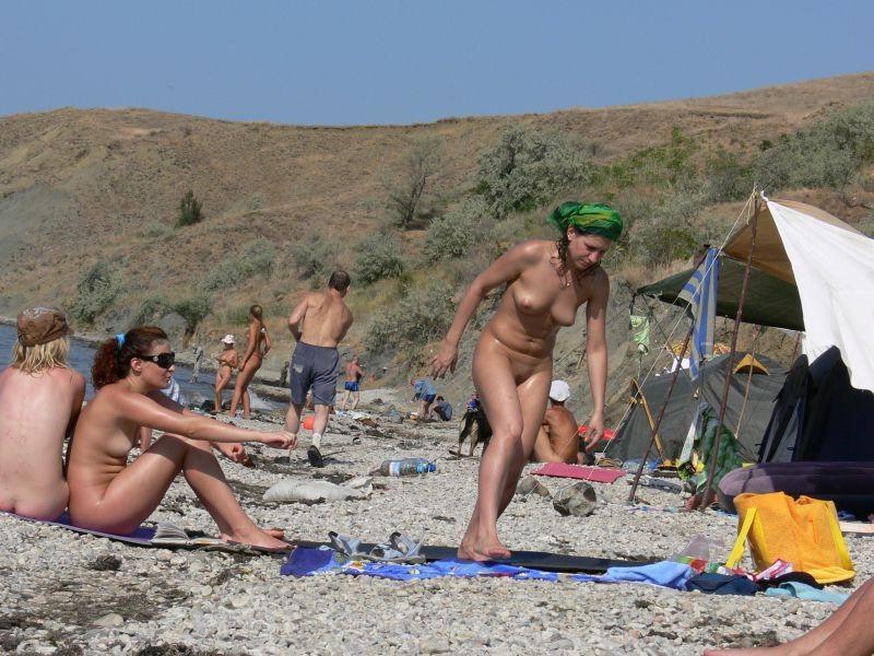 15P Watch the tits in the water from this nudist teen