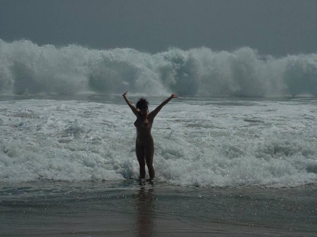 15P Watch the tits in the water from this nudist teen