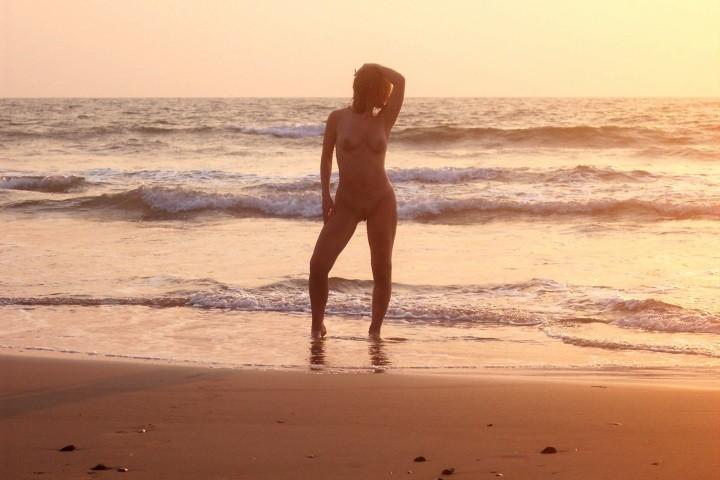 15P The water feels good on these nudist's bare skin