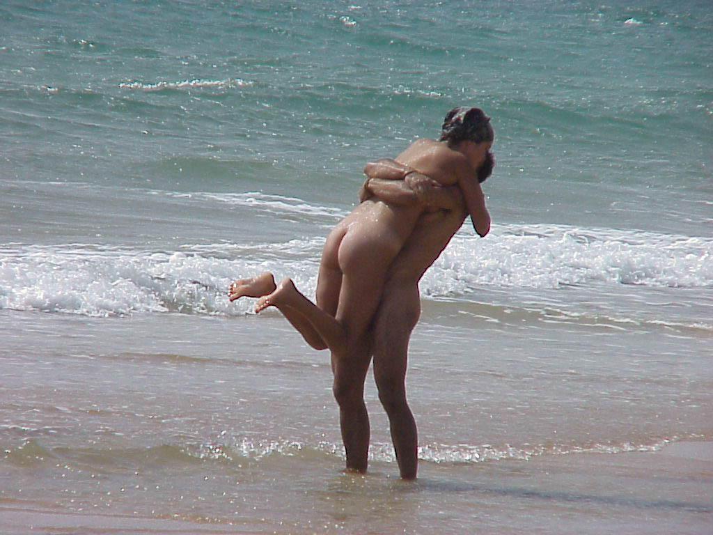 15P The water feels good on these nudist's bare skin