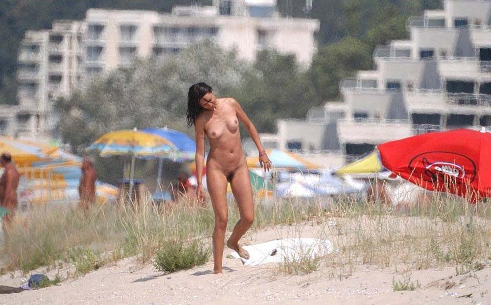 15P Check out this nudist showing off her shaved pussy
