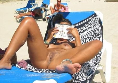 15P Check out this nudist showing off her shaved pussy