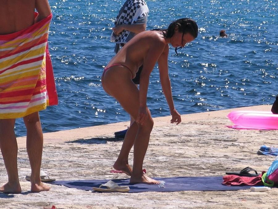 15P Check out this nudist showing off her shaved pussy