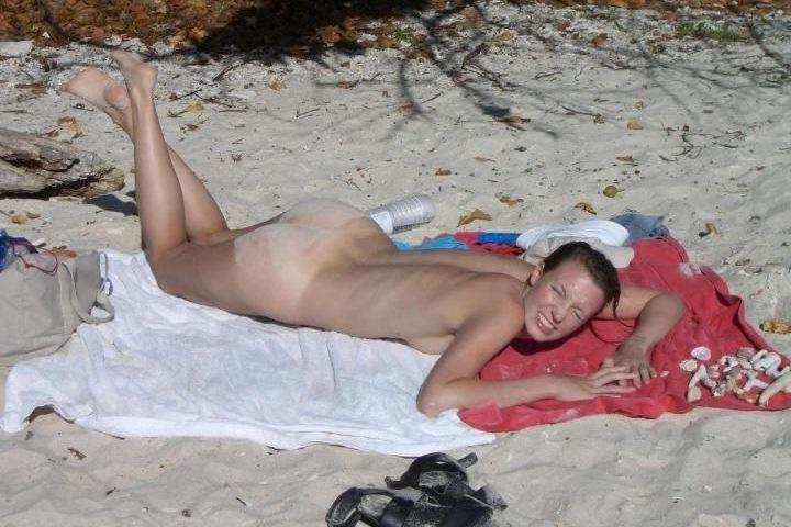 15P Check out this sexy nudist showing off her shaved pussy