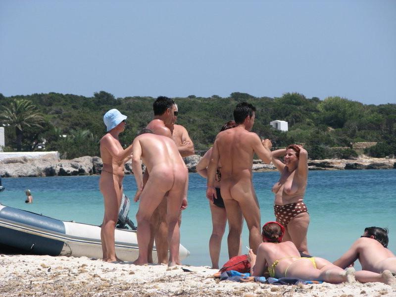 15P Check out this sexy nudist showing off her shaved pussy