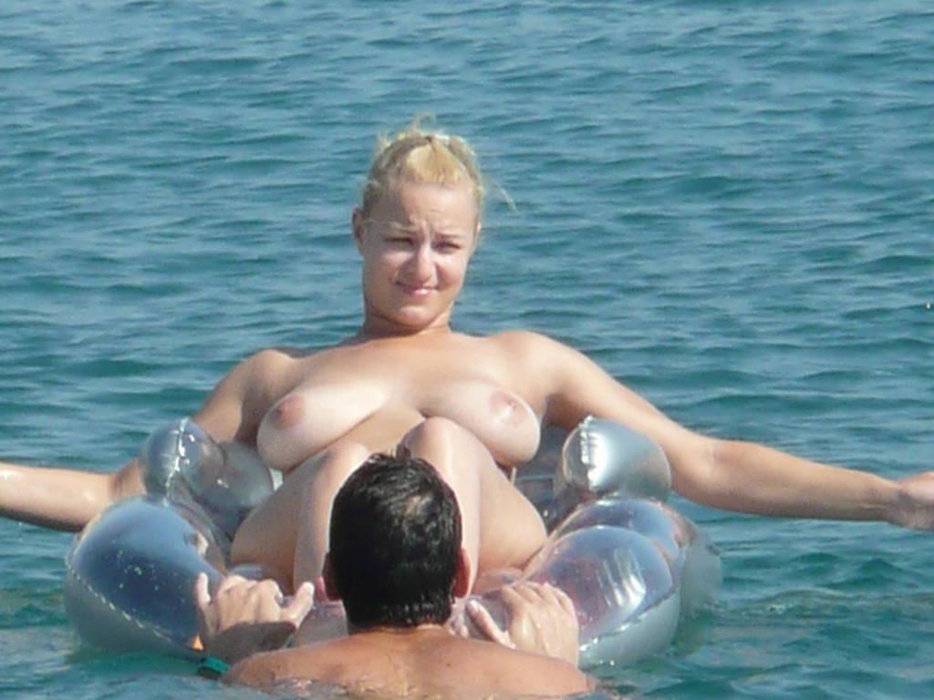 15P Gorgeous blonde young nudist plays in the water