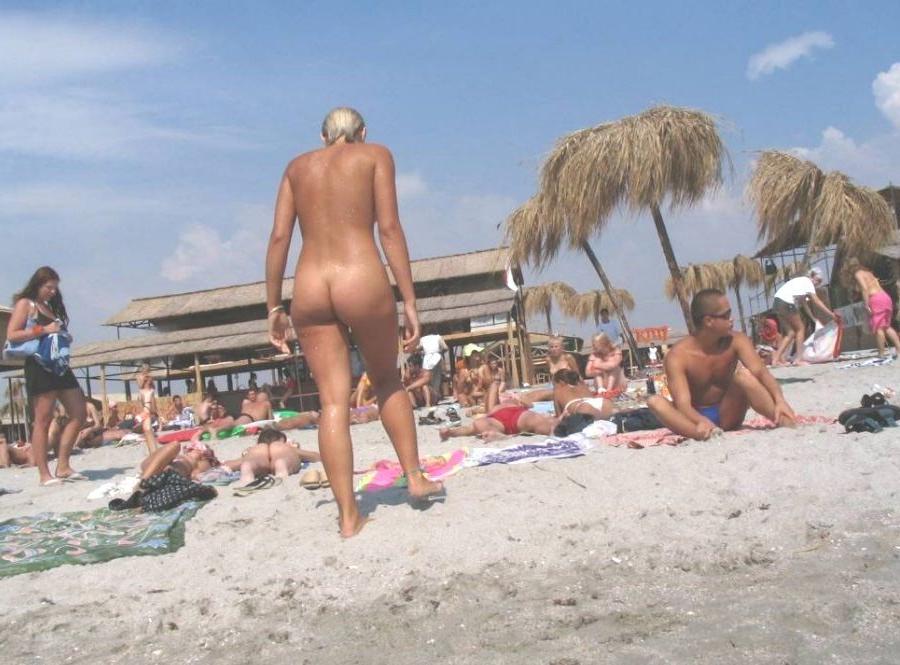15P Gorgeous blonde young nudist plays in the water