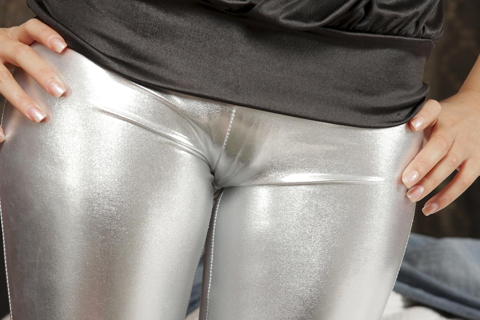 15P Hot brunette girl in her shiny silver pants
