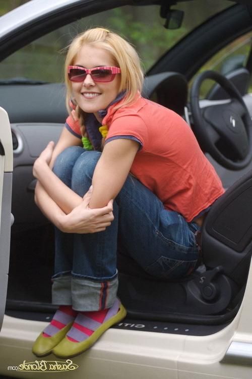17P Attractive young blonde model showing hot striptease in her car