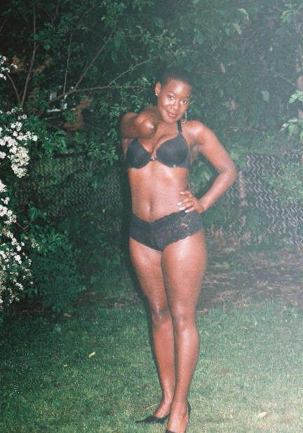 16P Black chick with short hair poses like a model