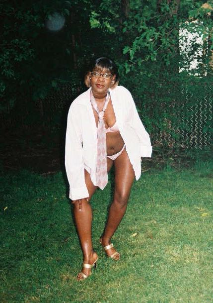 16P Black chick with short hair poses like a model
