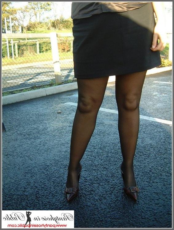 15P amateur woman posing in stockings in a car