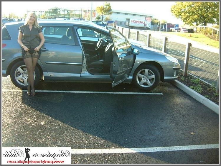 15P amateur woman posing in stockings in a car