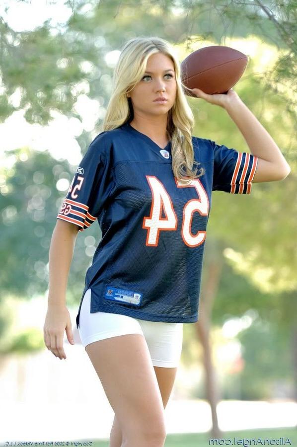 15P Busty Alison Angel playing football outside with camel toe
