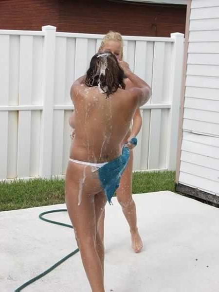 15P Two busty lesbians playing and washing a car