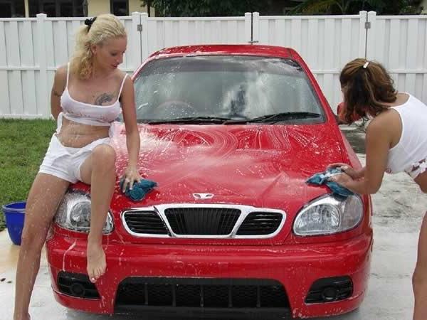 15P Two amateur girls playing and washing a car