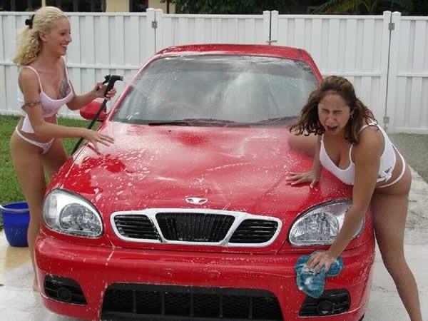 15P Two amateur girls playing and washing a car