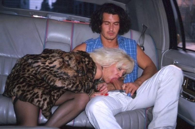 16P Kinky granny in stockings and fur coat blows hard cock in a limo