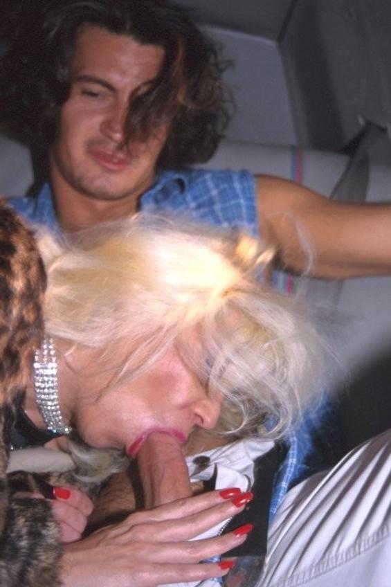16P Kinky granny in stockings and fur coat blows hard cock in a limo