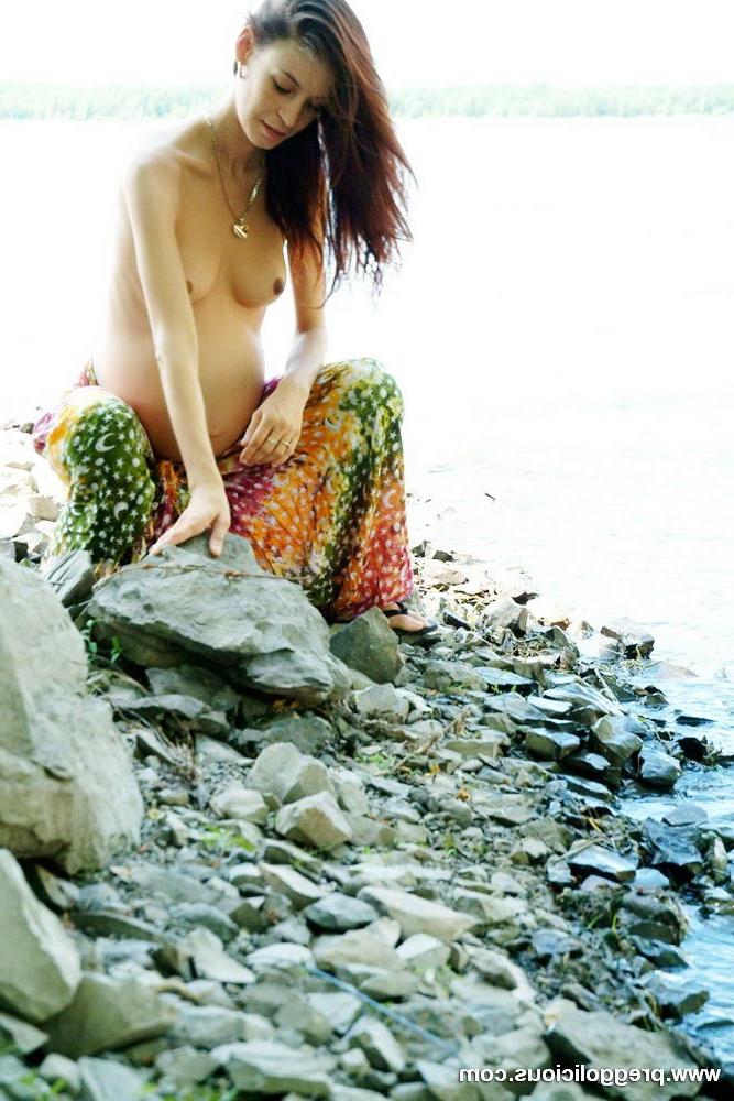 16P Pregnant beauty posing with her round belly outdoors